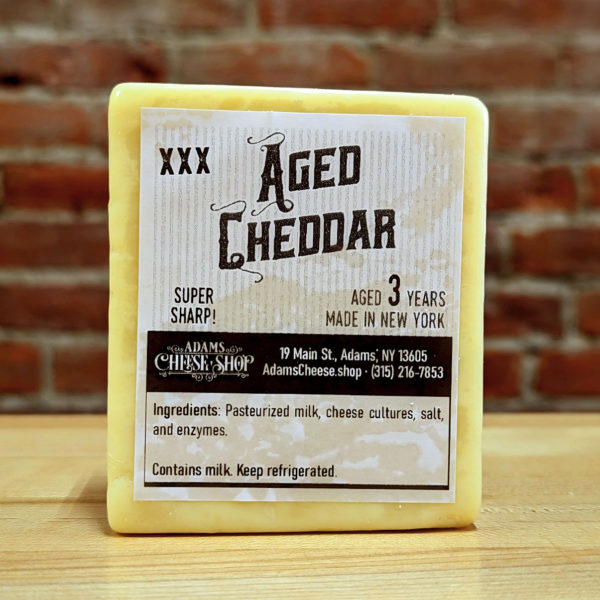 A half-pound block of 3X Aged Cheddar.