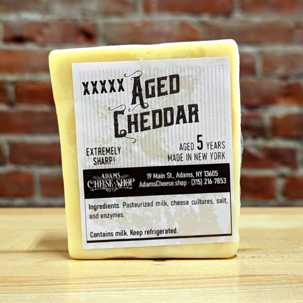 A half-pound block of 5X Aged Cheddar.