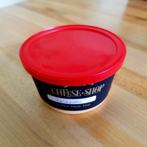 A tub of Jalapeno Cheese Spread.