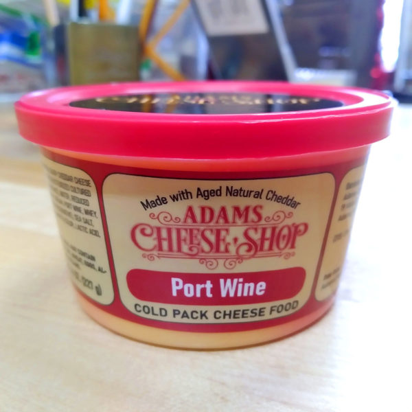 A tub of Port Wine cheese spread.
