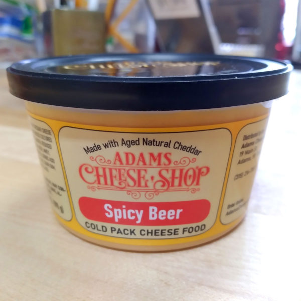 A tub of Spicy Beer cheese spread.