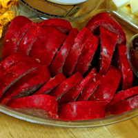 Slices of Crogan Bologna on a platter.