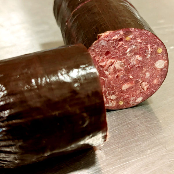 A summer sausage, cut in half.