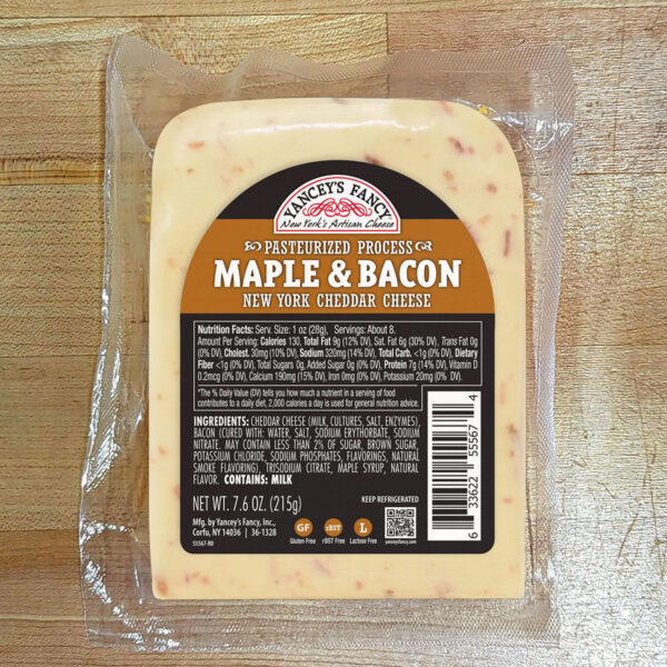 A wedge of Maple & Bacon Cheddar Cheese.