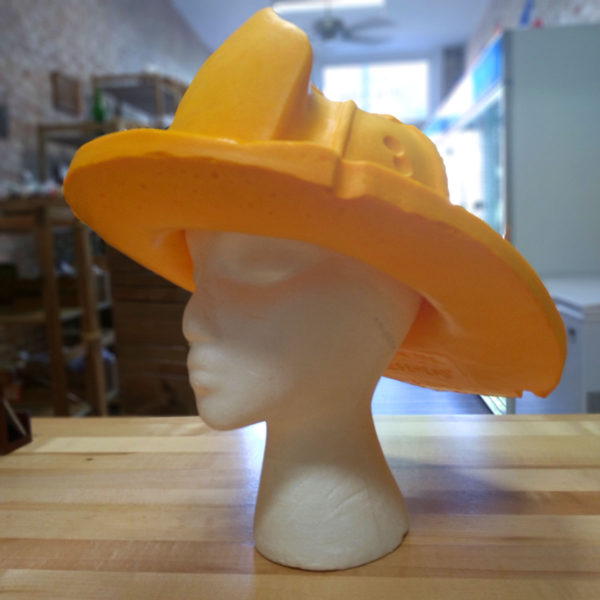 Original Cheesehead fireman hat on a styrofoam head.