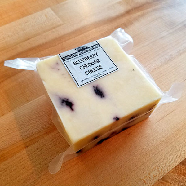 A brick of Blueberry Cheddar cheese.