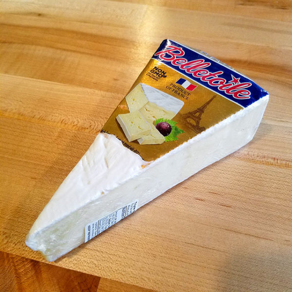 A wedge of Belletoile Triple Cream cheese.