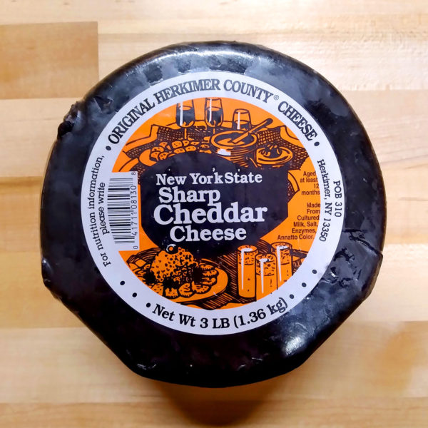 3 lb. Wax Dipped Sharp Cheddar Cheese Wheel, still wrapped.