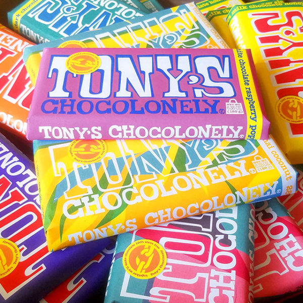 A stack of Tony's Chocolonely chocolate bars.