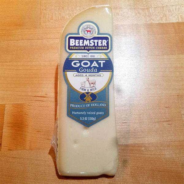 A wedge of Beemster Goat Gouda.
