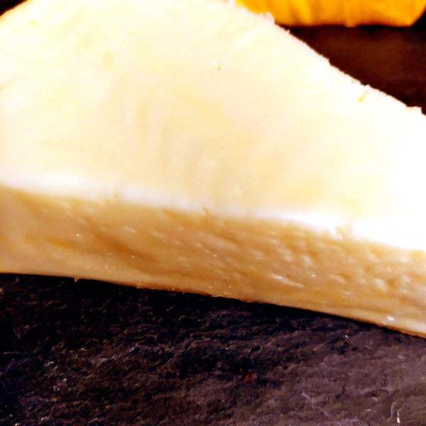 A closeup view of Port Salut cheese.
