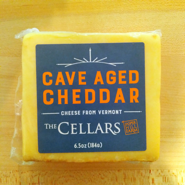 A block of Cave Aged Cheddar cheese.