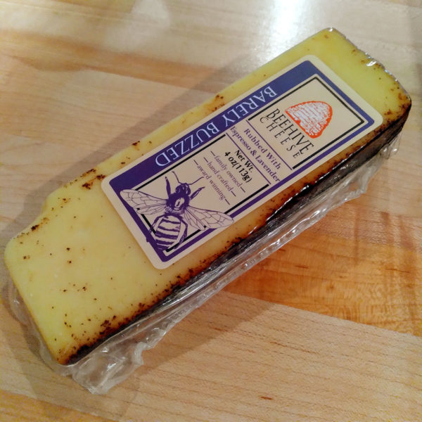 A wedge of Barely Buzzed Beehive Cheese.