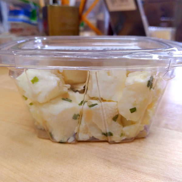 Garlic & Chive cheese curd snack pack, side view.