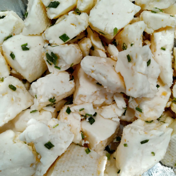 Closeup of Garlic & Chive cheese curd.