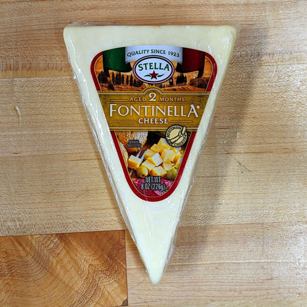 Top view of a wedge of Stella Fontinellla cheese.