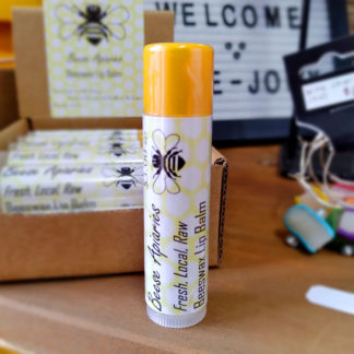 A stick of Beese Apiaries Beeswax Lip Balm.