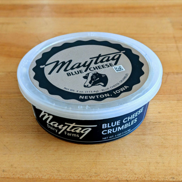 A container of Maytag Blue Cheese crumbles.