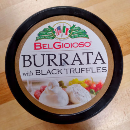 A closeup of the lid from a container of BelGioioso Burrata with Black Truffles.