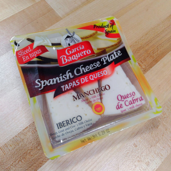 An alternate angle of an unopened package of Spanish Cheese Plate.