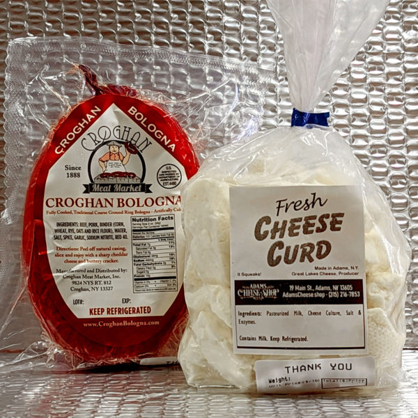 A ring of Croghan Bologna and a bag of cheese curd packed in a silver liner.