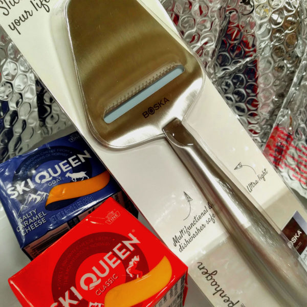 Contents of Norwegian Julegave Pack (2 Brunost Cheeses / Cheese Slicer).