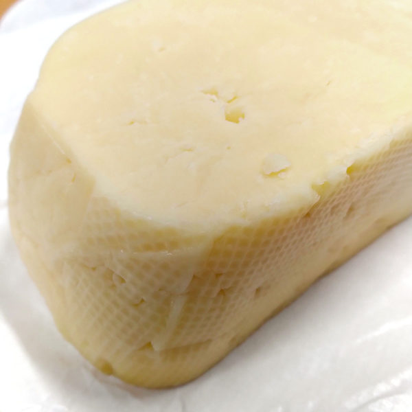 Extreme closeup of Black River Valley Natural farmer's cheese.