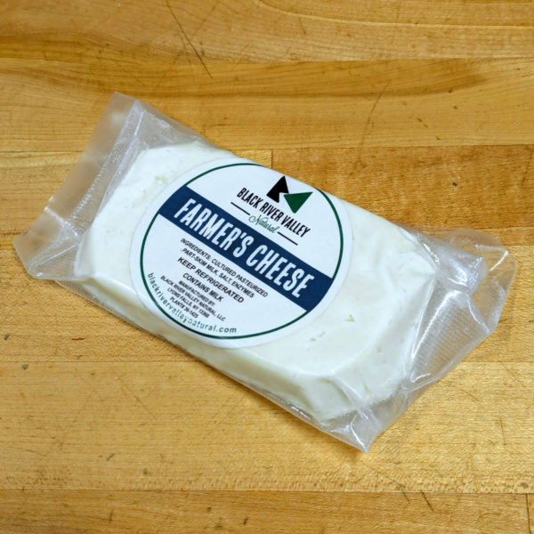 Wrapped block of farmer's cheese.