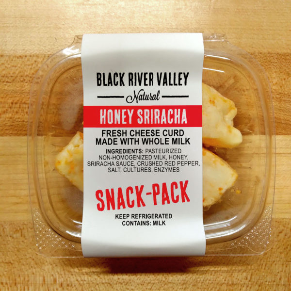 Container of Honey Sriracha flavored cheese curd.