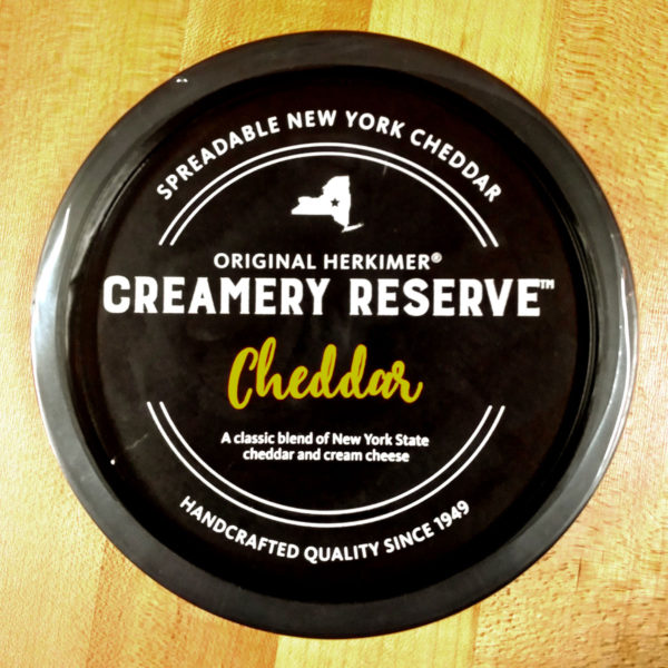 The lid from Creamery Reserve Cheddar Cheese Spread.