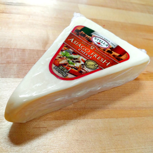 A wedge of Asiago Fresh Cheese.