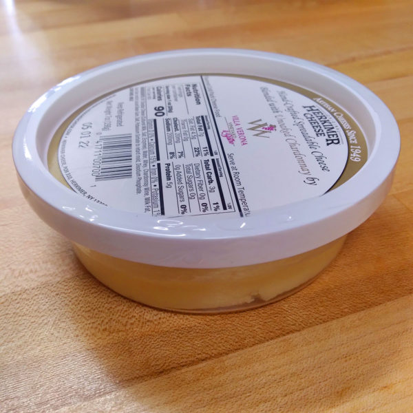 A tub of Unoaked Chardonnay Cheese Spread.