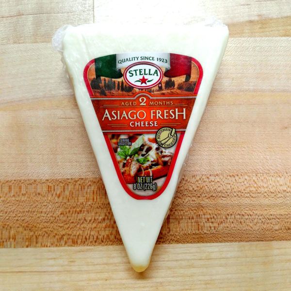 Alternate view of a wedge of Asiago Fresh Cheese.