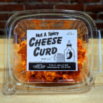 A container of Hot & Spicy Cheese Curd.