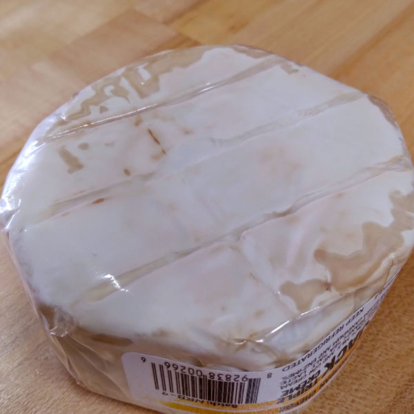 Underside of a wheel of Adiron-Jack cheese.