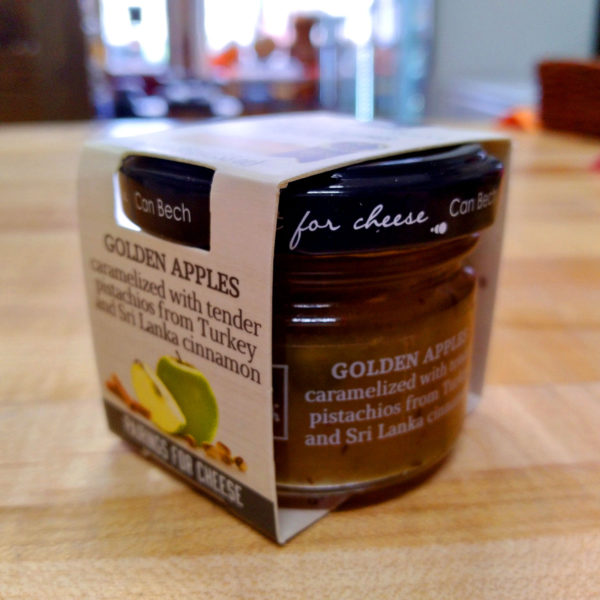 Side view of a jar of Just for Cheese, Golden Apple Spread.