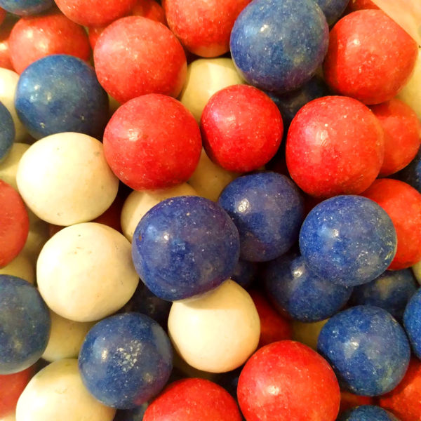 Closeup of Red, White & Blue American Candy Coated Dark Chocolate Malted Milk Balls.