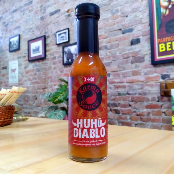 A bottle of Huhu Diablo hot sauce.
