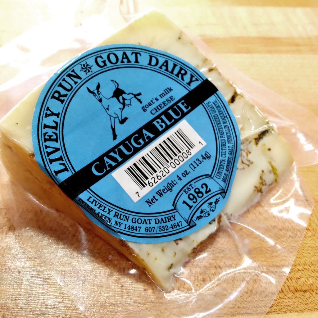 A wedge of Cayuga Blue cheese, in wrapper.