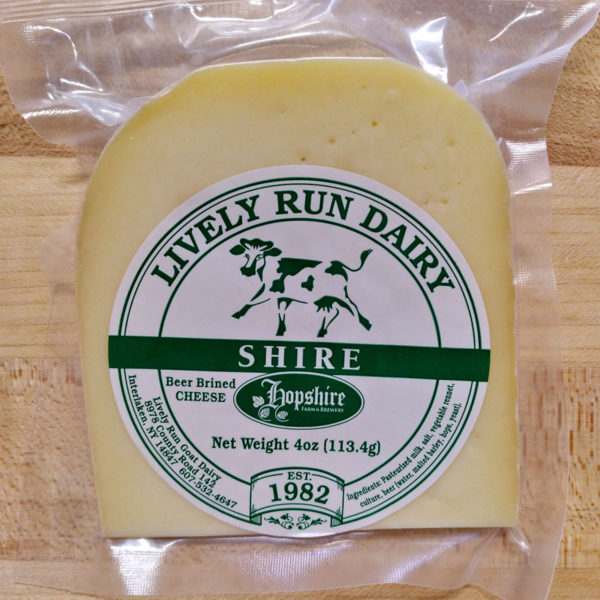 A wedge of Shire cheese, in wrapper.
