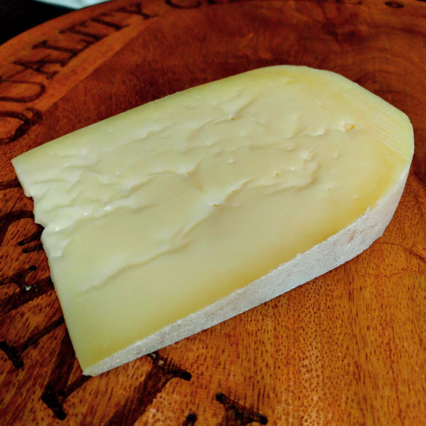 A wedge of Shire cheese, in wrapper.
