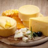 A platter featuring a variety og cheeses.