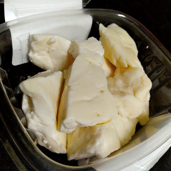 A closeup of Natural Whole Milk Cheese Curd.