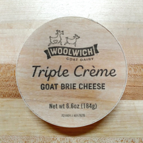 Lid of a wooden Triple Creme Goat Brie box.