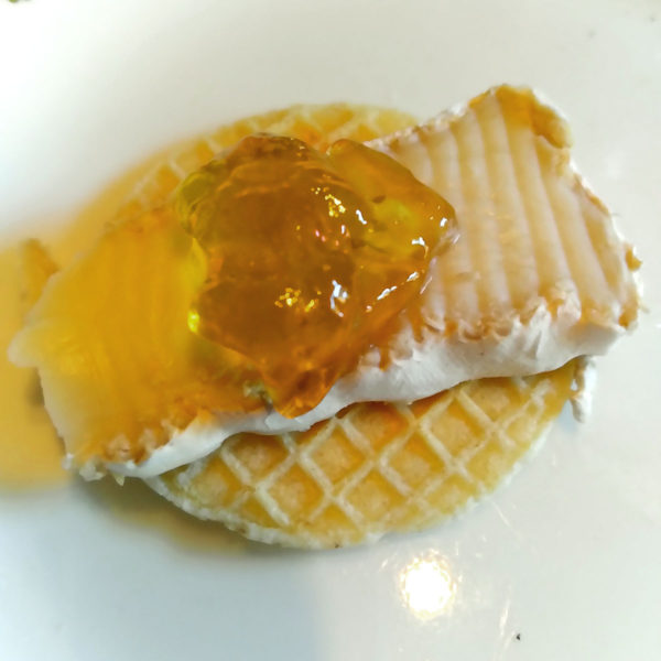 Triple Creme Goat Brie on a Crispy French Cracker, with dandelion jelly.