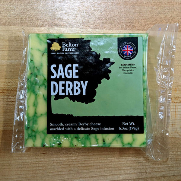 A block of Sage Derby cheese, in wrapper.