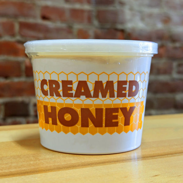 A container of Beese Apiaries creamed honey.