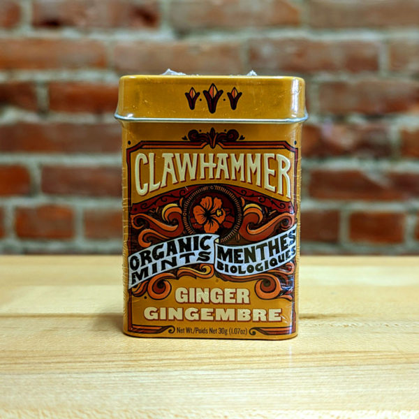 The front of a tin of Spicy Ginger Clawhammer Organic Mints.