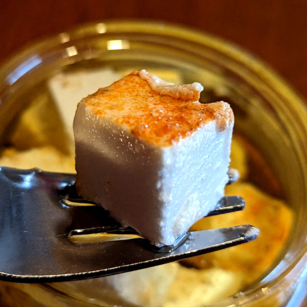 Closeup of a chunk of Smokey Bush Tomato Buffalo Milk Persian Feta.