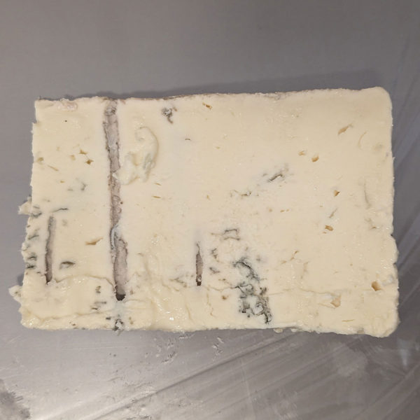 Alternate view of a wedge of Gorgonzola Dolce cheese.